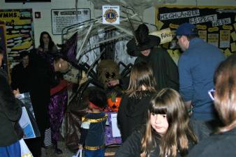 A big spider guards the Lions Club trunk at the second Spooktacular event Saturday.
