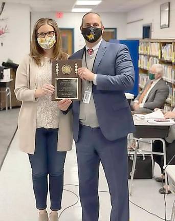 Superintendent of Schools Dr. Alex Anemone presented retiring Trustee Nicole Fritz with a plaque in honor of her years of service to the district at the final school board meeting of 2020 on Dec. 15. Photo by Patricia Keller.