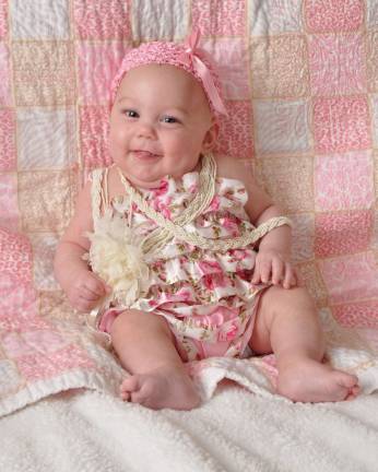 Oh Baby it's Spring! Baby Photo Contest Photo, Kim Feely of Hamburg Emma Leigh, 6 months old. "Cute as a button."