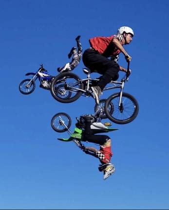 Top acts and ‘good old-fashioned fun’ at fair <b>Johnny Rockett’s Cycle Circus’ freestylers fly throught the sky.</b>