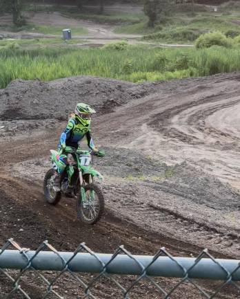 Girls on the field, ice, mat West Milford’s Ella Hammett rides her dirt bike. (Photo provided)