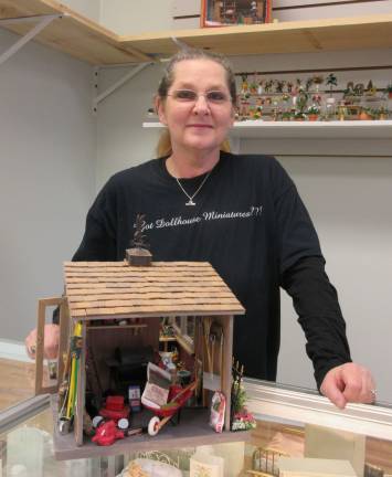 Photos by Ginny PrivitarOwner of Miniature Dollhouse Creations Del Ashe shows off her work in her new store in Newfoundland.
