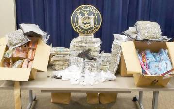 District Attorney David M. Hoovler said a search warrant executed at the Montgomery home of Marius and Nancy Schwerberg yielded cocaine and marijuana having a street value of $180,000 and more than $ 1.1 million dollars in cash. Photo provided by New York State Police.