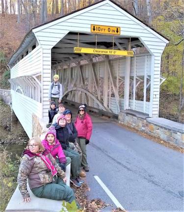 The Scouts at a covered bridge at Valley Forge.