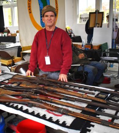 Peter Schichtel displays antique rifles that have been identified as relics from the Battle of Little Big Horn.