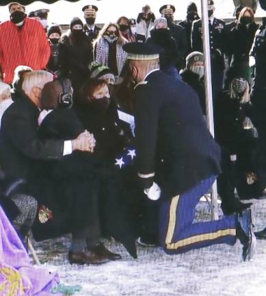 ‘He got cheated out of time, but he didn’t get cheated out of life’ The ceremonial presentation of the flag to the mother of the deceased, Anne Prial