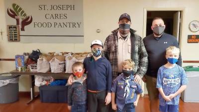 West Milford. Cub Scouts collect for food drive