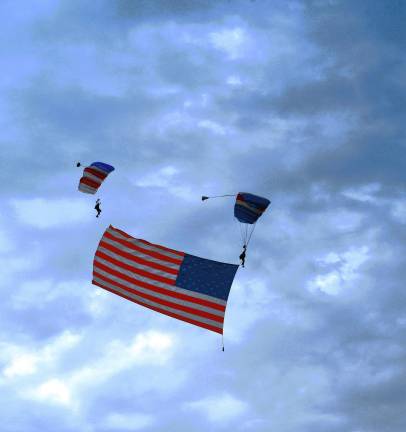 NJ Airshow plans return this fall A huge American flag is held by parachutists during the NJ Airshow on Friday evening, June 13 in West Milford. (Photo by Maria Kovic)