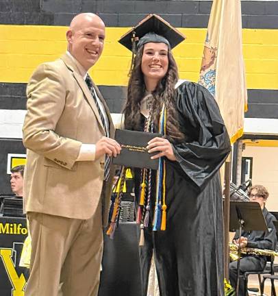 Photos: West Milford High School graduation A graduate poses with her diploma.