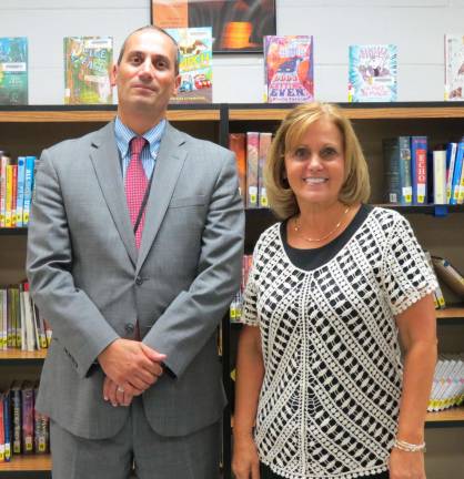 Photo by Patricia Keller A big welcome back to a familiar face. Dr. Joan Oberer, who was named interim principal at Westbrook Tuesday night, is welcomed by Dr. Alex Anemone, superintendentof West Milford schools.