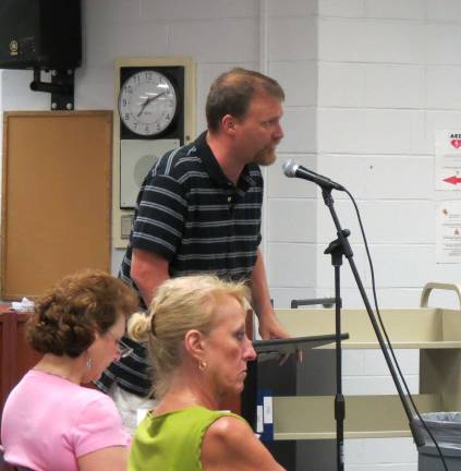 Parents want special ed director out William Stillman addresses the school board Monday. He called for the board to not reappoint Alice Steinheimer to her position as head of special services.