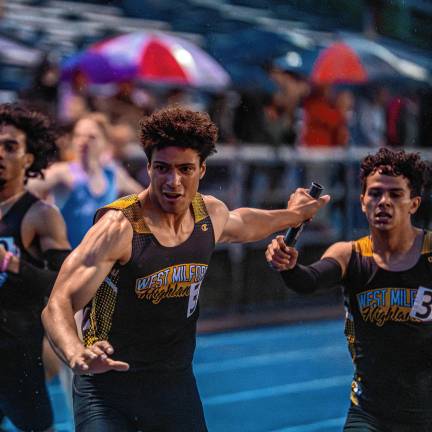 Lowenstein 10th in state LA1 Lorenzo Andrade hands the baton to Julian Pierre at the Passaic County Championship meet May 8. (Photo by TJ Nolan)