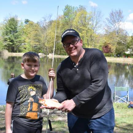 Henry Romyns caught the golden trout. With him is his father, Aaron.