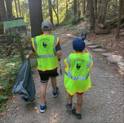 Local family visits more than 80 waterfalls since March Carlozzi boys Matt and Maximilian cleaning up trash at The Delaware Water Gap.