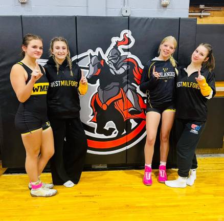 Girls on the field, ice, mat Taylor Keegan, Maddie Hammett, Ariana Canipe and Jackie Sloan are victorious in last year’s matches against Lakeland.( Photo by Lauren Hammett)