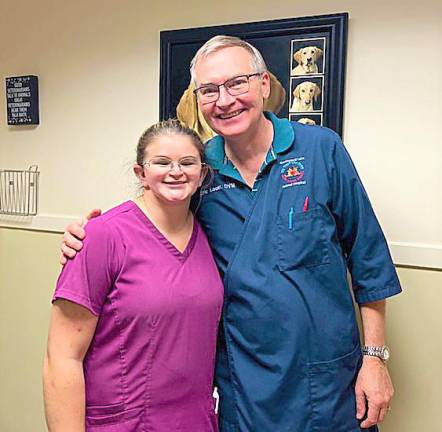 Intern Isabella Stefanides stands next to Dr. Eric Louër, of the Greenwood Lake Animal Hospital.