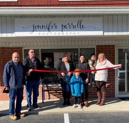 Jennifer Parrello celebrates her studio’s grand opening alongside her children, family, and Mayor Michelle Dale. Left to right: Nino Parrello, Gary Zielinski, Mayor Michele Dale, Hadley Parrello, Jennifer Parrello, Gage Parrello, Shirley Parrello. Photo provided.