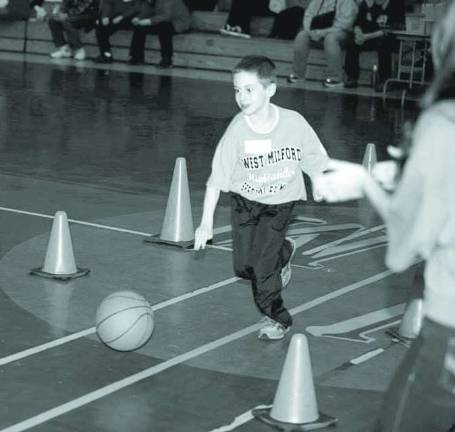 Michael McCloskey does the 10 meter speed dribble.