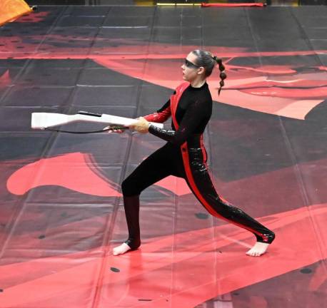 Abigail Viering, a junior, performs with a wooden rifle during the show. (Photo by Bret Harmon)