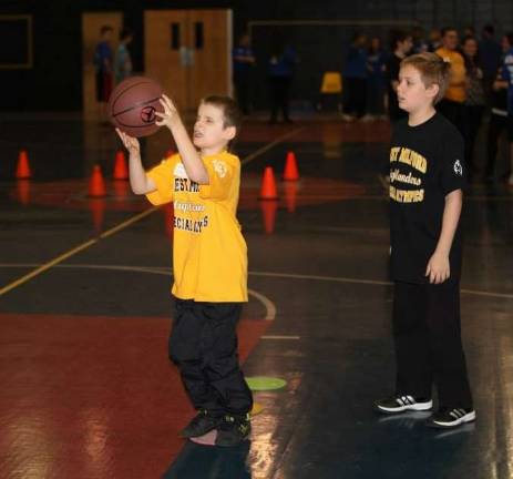 Ty Rockey is shown here competing at Spot Shot with volunteer Collin Longeill.