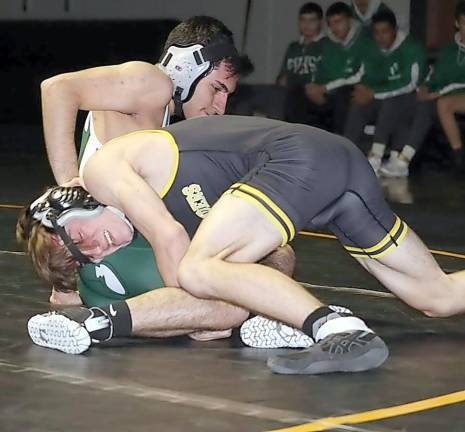 Aiden Highers takes down a wrestler from Passaic Valley. Photo was taken last year by Linda Heisler.