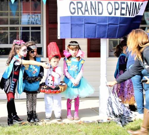 The costume contest during Loving Care Veterinary Hospital's grand opening on Saturday.