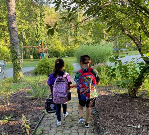First day of school in West Milford Connor and Chloe walking off to second and third grade, respectively.