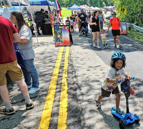 Community Day features street fair The inaugural West Milford Community Day featured 42 local vendors and sponsors set up along Nozenzo Pond Road. (Photos by Rich Adamonis)
