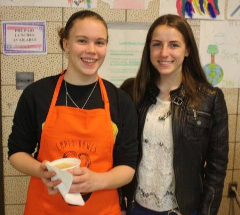 Soup to go was an option. Here, Lauren Girardin, 16, and Madeline Pluta, 18, serve some of the homemade soup.