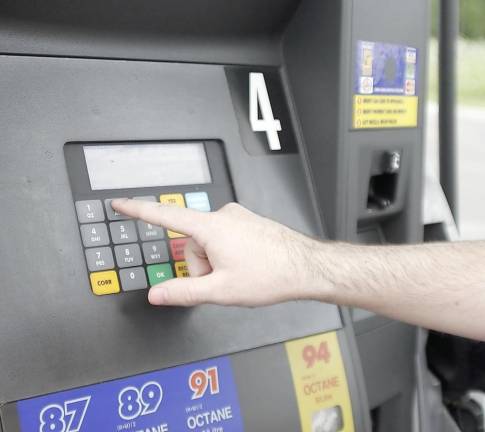 AAA Mid-Atlantic said the average price of a gallon of regular gas in New Jersey on Friday was $3.20, unchanged from a week ago. Drivers were paying an average of $2.21 a gallon a year ago at this time. Photo illustration by Kelly K from FreeImages.