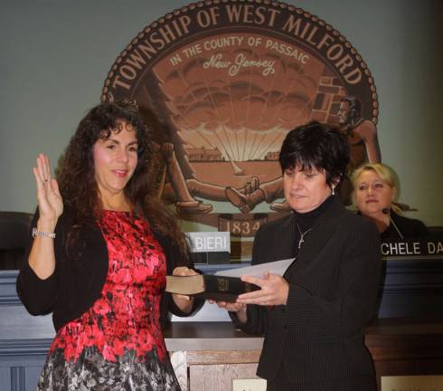 I do solemnly swear... Photos by Linda Smith Hancharick Mayor Bettina Bieri took her third oath of office as mayor in the township. Township Clerk Antoinette Battaglia, right, administered the oath to her.
