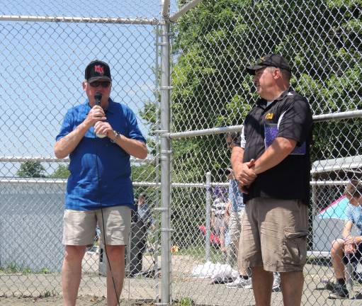Welcome to the Bob Henry T-Ball Field Bob Henry speaks to the crowd at the dedication of the field to him. At right is West Milford Little League President John Fabbo.