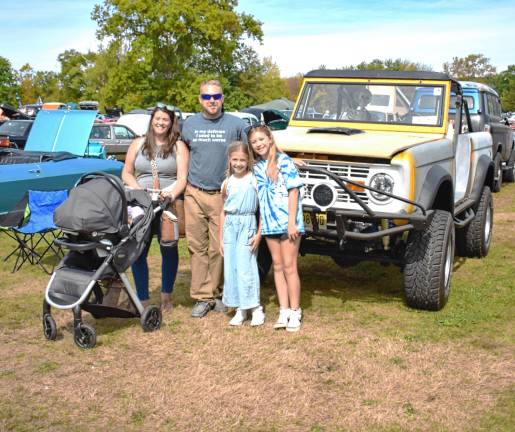 Car show attracts 400 Doug Grayson and his family in front of their 1976 Ford Bronco.