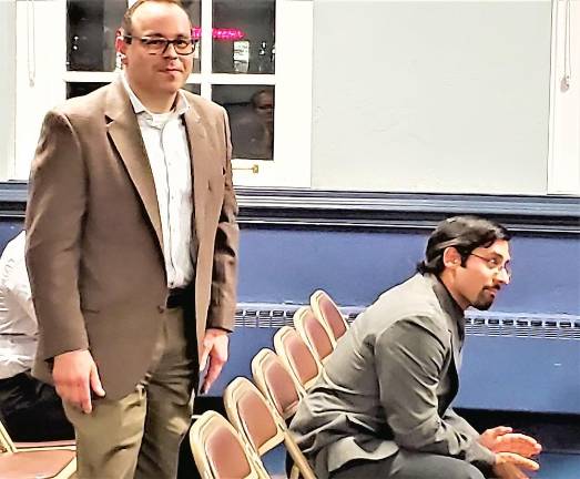 Newly appointed administrator and clerk Bill Senande (standing) is recognized at the end of Wednesday night's Township Council meeting.