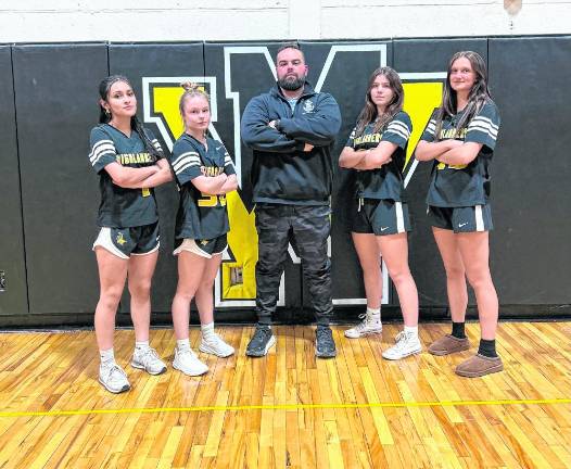 West Milford High School girls flag football coach Matt Keyzer poses with senior co-captains, from left, Tiffany Vargas, Kailey Maskerines, Avery Vacca and Aubrey Fritz. (Photos provided)