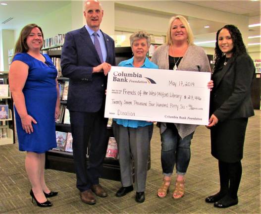 Columbia Bank donates $27K for new town hall lift Mayor Michele Dale accepts a check from the Columbia Bank for a new lift to enable persons unable to navigate stairs to get to the Health Department at West Milford Municipal Building. From left are: Columbia’s West Milford Branch Manager Amy Lewis, President/ Chief Executive Officer Thomas J. Kemly, Friends of the Library President Martha Tappan and Acting Executive Director Minoska Mateo. Ann Genader photo