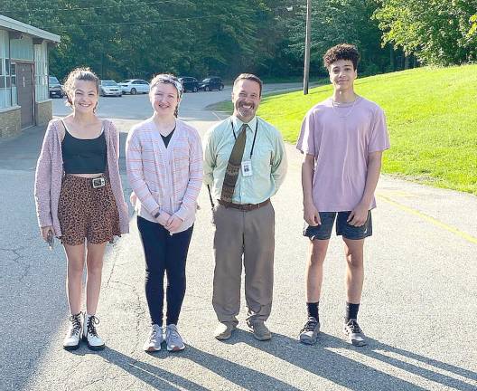 Eighth graders Margaret Redner, Ella Stephenson, and Julian Pierre.