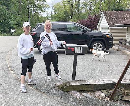 Dotty Oppel shared this photo with the West Milford Messenger: Pam and Sam Collins of Forest Lake Drive happily surprised their neighbors by putting flags by our mailboxes to celebrate Memorial Day.