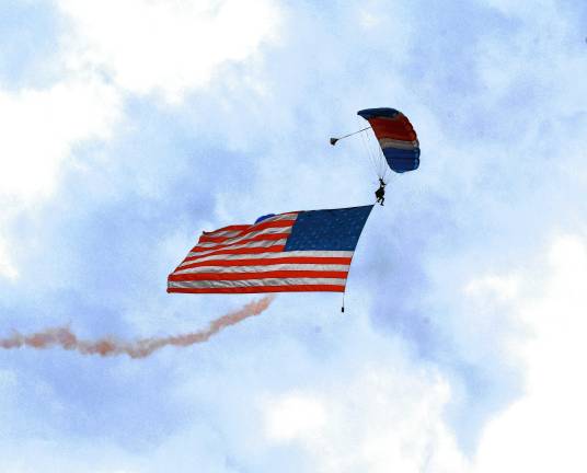 NJ Airshow plans return this fall A huge American flag is held by parachutists during the NJ Airshow on Friday evening, June 13 in West Milford. (Photo by Maria Kovic)