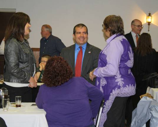C.A.S.A. opens some eyes Photos by Linda Smith Hancharick Councilman Lou Signorino speaks with school board Trustee Marilyn Schultz, left, and Bobbie Del Sol, the township nurse, right, at Monday night's dinner.