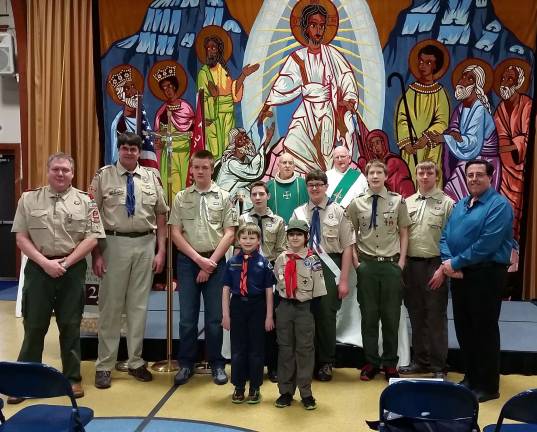 St. Joseph's celebrates Scout Sunday Rev. Steve Shadwell of St. Joseph Parish along with Deacon Harry, back, are seen here with scouts John Buechel, Jeff Hanson, Alex Poelzing, Ryan Jordan, Tim Magasic, Tom Buechel, Ian Poelzing and Mark Magasic; Patrick Weiss and Collin Keller, front.