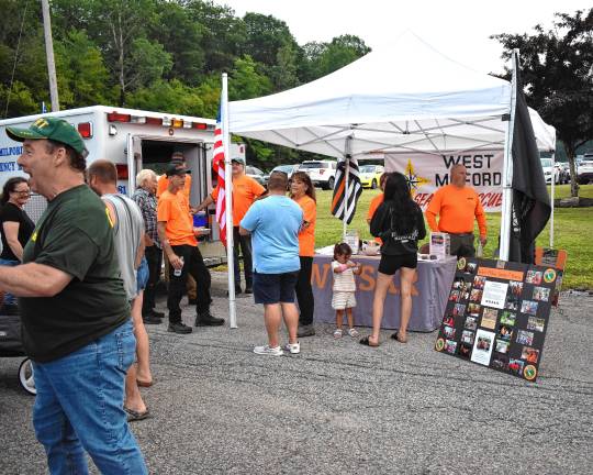 Community gathers for National Night Out Members of the Community Emergency Response Team (CERT) show off their work.