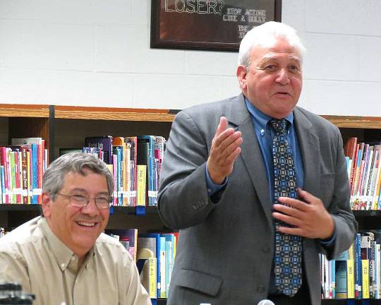 Interim superintendent bids farewell West Milford School Board President Dave Richards chuckles as Interim Superintendent John Petrelli addresses the board of education and audience members. Tuesday was Petrelli's last meeting as he moves on to another district next week.