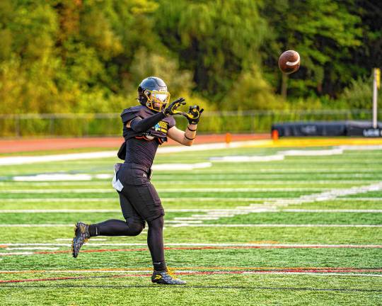 Highlanders beat Jefferson, 34-6 Mason Laneve receives a pass.