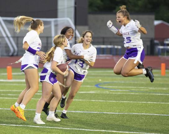 Girls on the field, ice, mat Warwick Valley's Eva Brown jumps for joy as she celebrates a touchdown during the 2023 Section 9 girls' flag football championship game. (Photo by Tom Bushey)