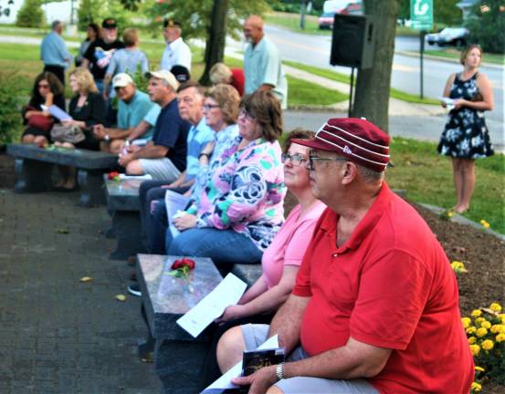 [residents gather at the 9/11 memorial in front of Town Hall Wednesday night for the annual ceremony. Charles Kim photo]