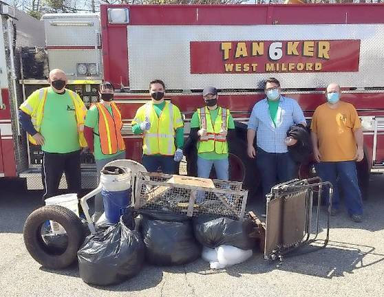 Members of the West Milford Volunteer Fire Company 6 and the Search and Rescue Team participated in the Roadside Cleanup program which was part of the West Milford Beautification Day held on Saturday, April 24. The members picked up garbage and debris along Ridge Road from Union Valley Road to Cahill Cross Road. Broken chairs, an animal trap, tires and construction materials were also removed from the roadside. All garbage and debris was placed curbside in front of the firehouse for pick up by the West Milford DPW. Pictured from left to right are: Kris Czuj, Dagmara Czuj, Jimmy Dygos, Patrick Sheehan, Mike Dygos and Michael Joy. Photo provided Ron Dygos.