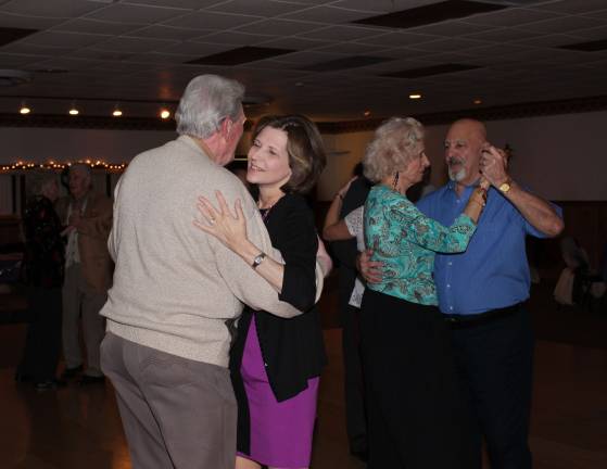 Gail Kahler bids farewell Changing partners for a swing around the dance floor.