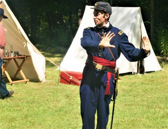[Members of the 6th New Hampshire regiment Union Civil War reenactors hold a demonstration at the Long Pond Ironworks State Park in Hewitt on Saturday. Charles Kim photo]