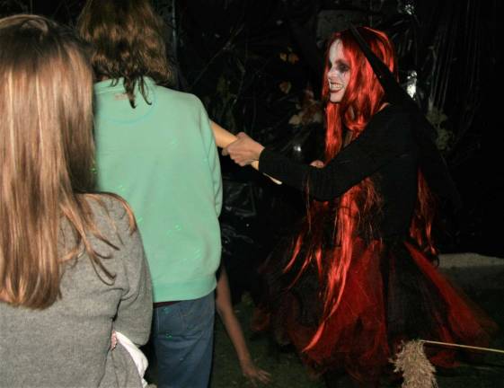 A female ghoul taunts visitors to the &#x201c;Haunted Hallway&#x201d; during the second annual Spooktacular event in West Milford on Saturday.